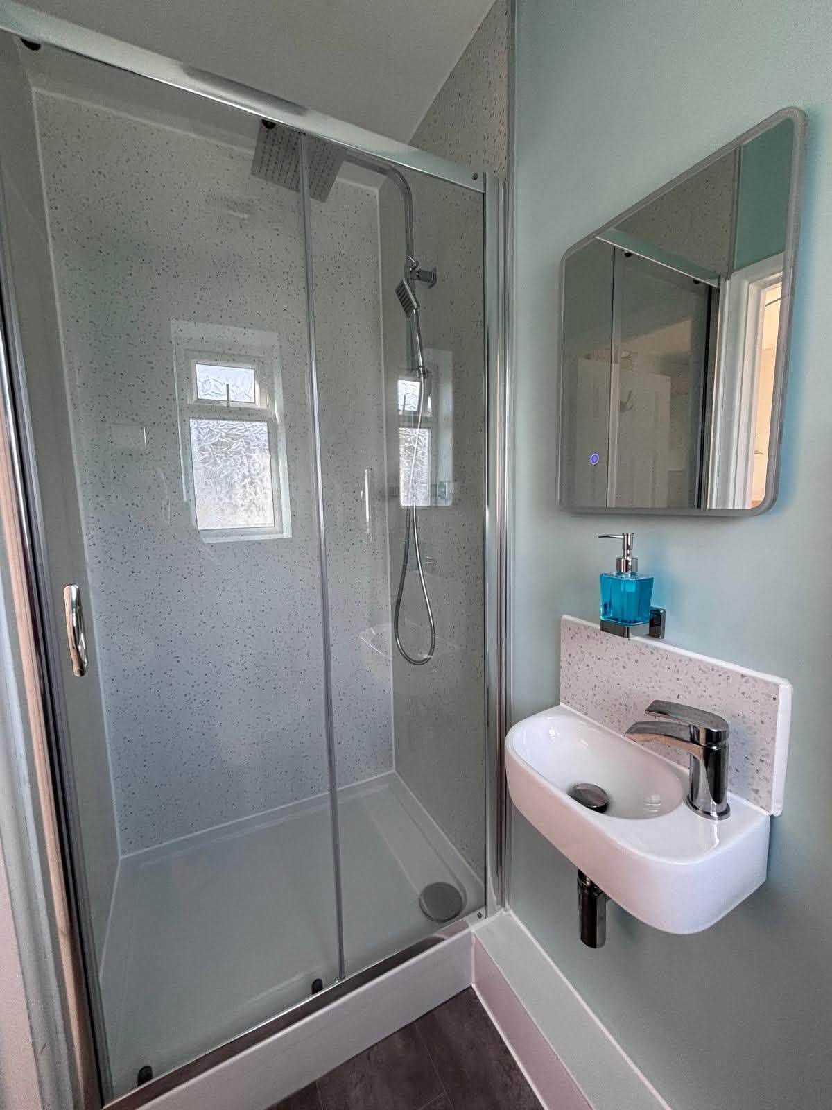 Completed shower room with fitted basin